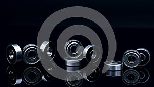 Stainless steel ball bearing on balck backgroud. Set of thrust ball bearing and silver ball bearing. Spare parts for roller