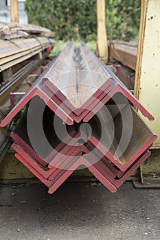 Stainless steel beams deposited in stacks photo