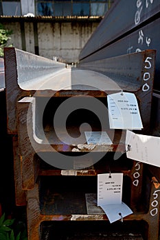 Stainless steel beams deposited in stacks photo