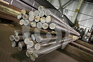 Stainless steel beams deposited in stacks photo