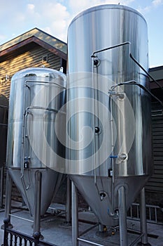 Stainless steel brewing and storage tanks at a brewery