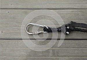 Stainless steel carabiner with Lock. Stainless steel carbiner with eyelet and lock. Nautical accessories concept