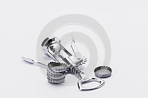 Stainless steel corkscrew with metal lids on white background