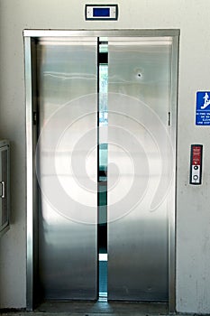 Stainless steel elevator doors closing