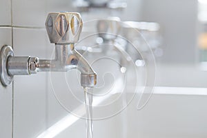 Stainless steel faucets in the bathroom of the school