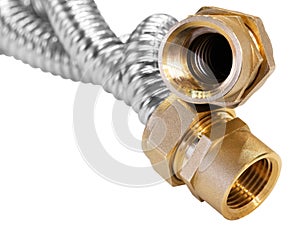 Stainless steel flexible hoses and flexi pipes, fittings and pressure joints close-up mackro. Industrial metal concept photo