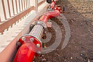 Stainless steel flexible pipe with red steel pipe and valve for fire extinguishing system in the industrial factory