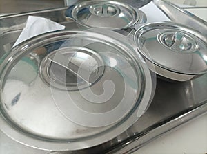 Stainless steel food bowl set on tray