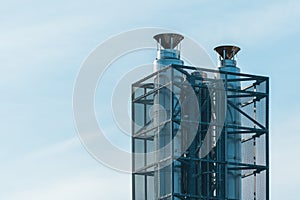 Stainless steel industrial chimneys with protective grid mesh
