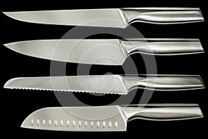 Stainless Steel Kitchen Knives Four Piece Set Isolated on Black Background