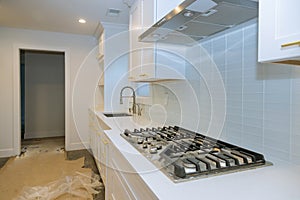 Stainless steel kitchen sink and modern kitchen interior with new oven kitchen in the apartment