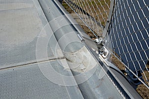 stainless steel mesh stretched on the bridge railing. the lower steel rope serves