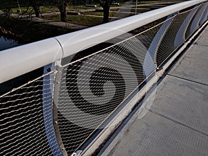 stainless steel mesh stretched on bridge railing.lower steel rope serves