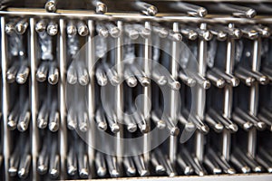 Stainless steel metal grilles stacked. Selective focus. Home inventory, design,