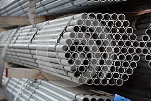 Stainless steel pipes deposited in stacks photo