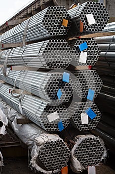 Stainless steel pipes deposited in stacks photo