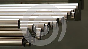 Stainless steel pipes are a finished product of metal rolling in factory.