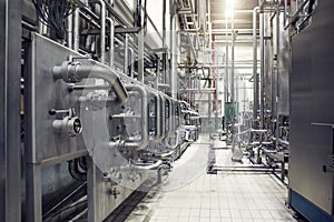 Stainless steel pipes and reservoirs or tanks, industrial beer production, metal pipeline in brewery fermentation and distillation