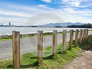 Stainless steel poles to restrict traffic in pedestrian areas by the road side.