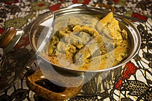 A stainless steel Pot of groundnut soup similar to Nigerian banga soup photo