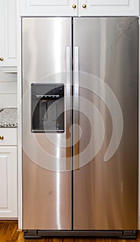 Stainless Steel Refigerator with White Cabinets