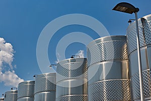 Stainless steel reservoirs for wine at modern winery