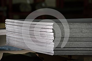 Stainless steel sheets deposited in stacks photo