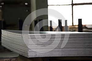 Stainless steel sheets deposited in stacks photo