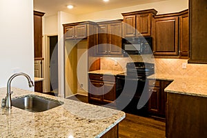 Stainless Steel Sink and Black Appliances