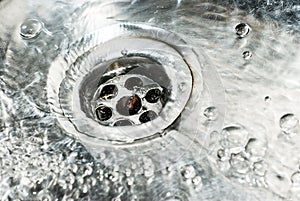 Stainless steel sink plug hole close up