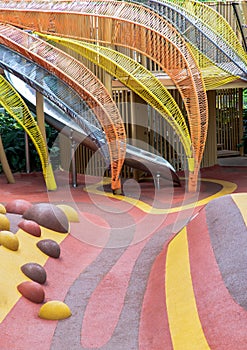 Stainless steel slider in the kid`s playground area. Children`s playing area indoor