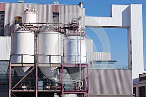 Stainless steel storage tank containers at the chemical plant factory