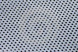 Stainless steel textured metal surface with holes