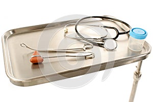 Stainless steel tray with healthcare supplies