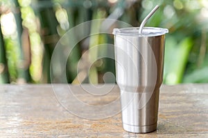 Stainless steel tumbler with stainless straw keeping of the drink cold or hot photo