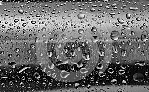 Stainless steel with water drops on the rounded surface.