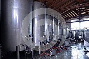 Stainless steel wine vats in a row