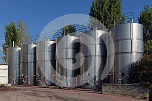 Stainless steel wine vats in a row
