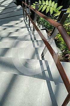 Stainless Steel with wooden hand rail on concrete ladder