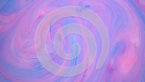 Stains of blue and pink ink on the water. Abstract colored background footage. Fluid design, perfect for motion graphics