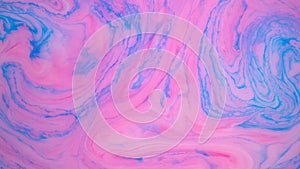 Stains of blue and pink ink on the water. Abstract colored background footage. Fluid design, perfect for motion graphics