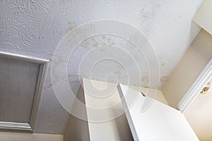 Stains on the ceiling after water leakage, humidity on wall