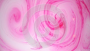 Stains of pink and white ink on the water. Abstract background footage.