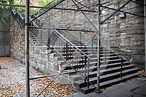 a stair case in the middle of an old building with scaffolding