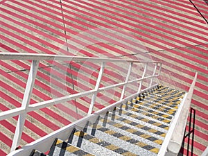 The stair on red stripe floor at tarmac area in airport. texture background.