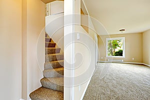 Staircase with carpet steps in empty house