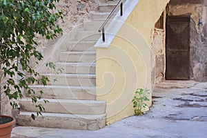 Staircase in the courtyard of an old residential building, traditional architectura of Catania, Sicily, Italy photo