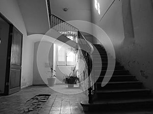 Staircase at the entrance of an old and abandoned house