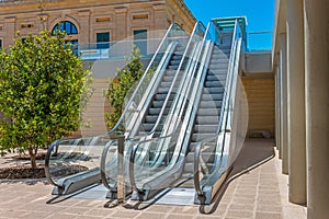 Staircase escalator bottom view on the outside street in the courtyard of the building