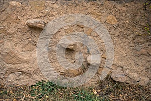 Staircase formed by 4 stones embedded in the wall forming 4 levels or steps.